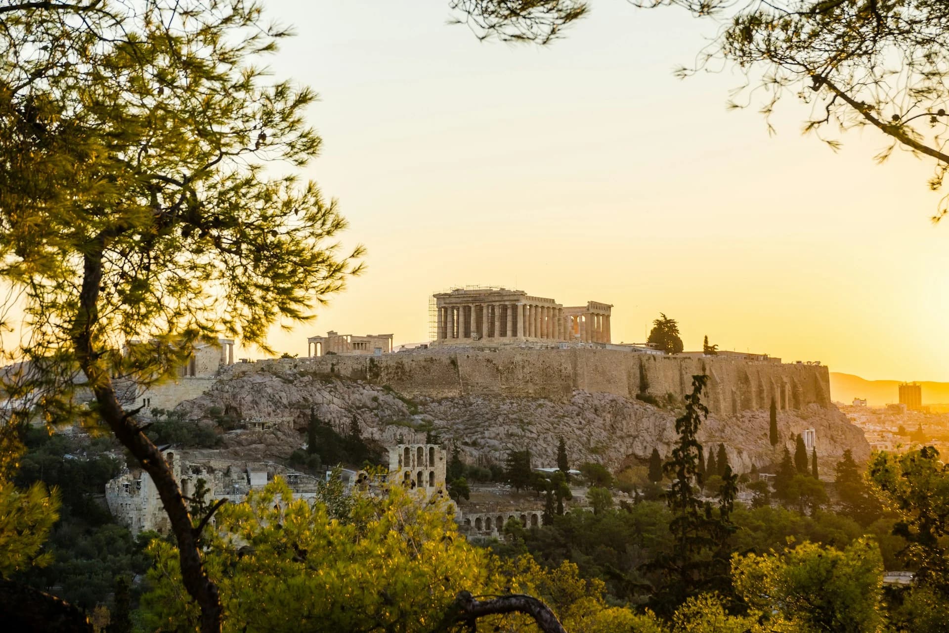 The Parthenon on the Acropolis above the rooftops of Plaka in Athens in late afternoon light