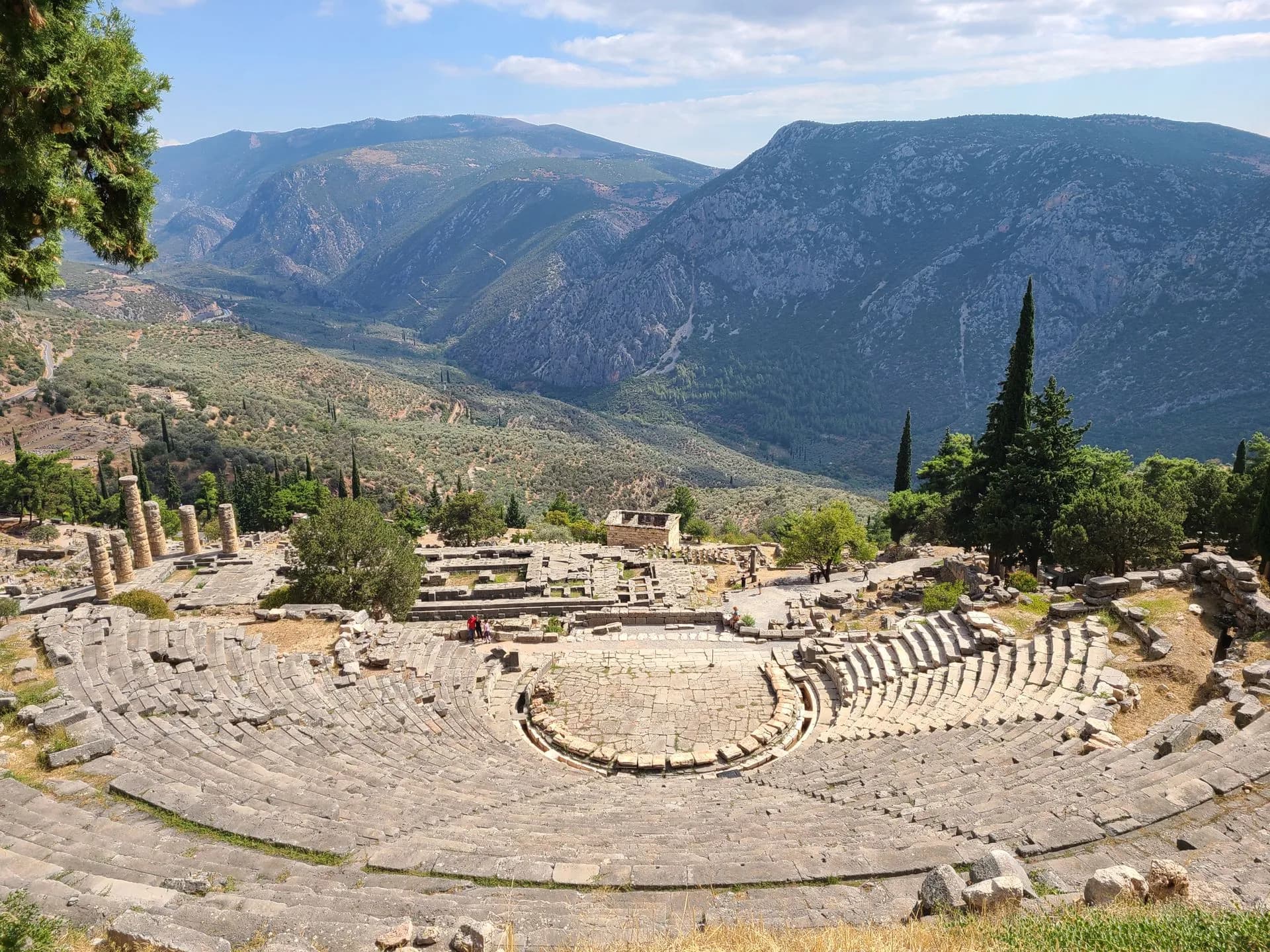 The Temple of Apollo columns at Delphi on the slopes of Mount Parnassus above the olive valley