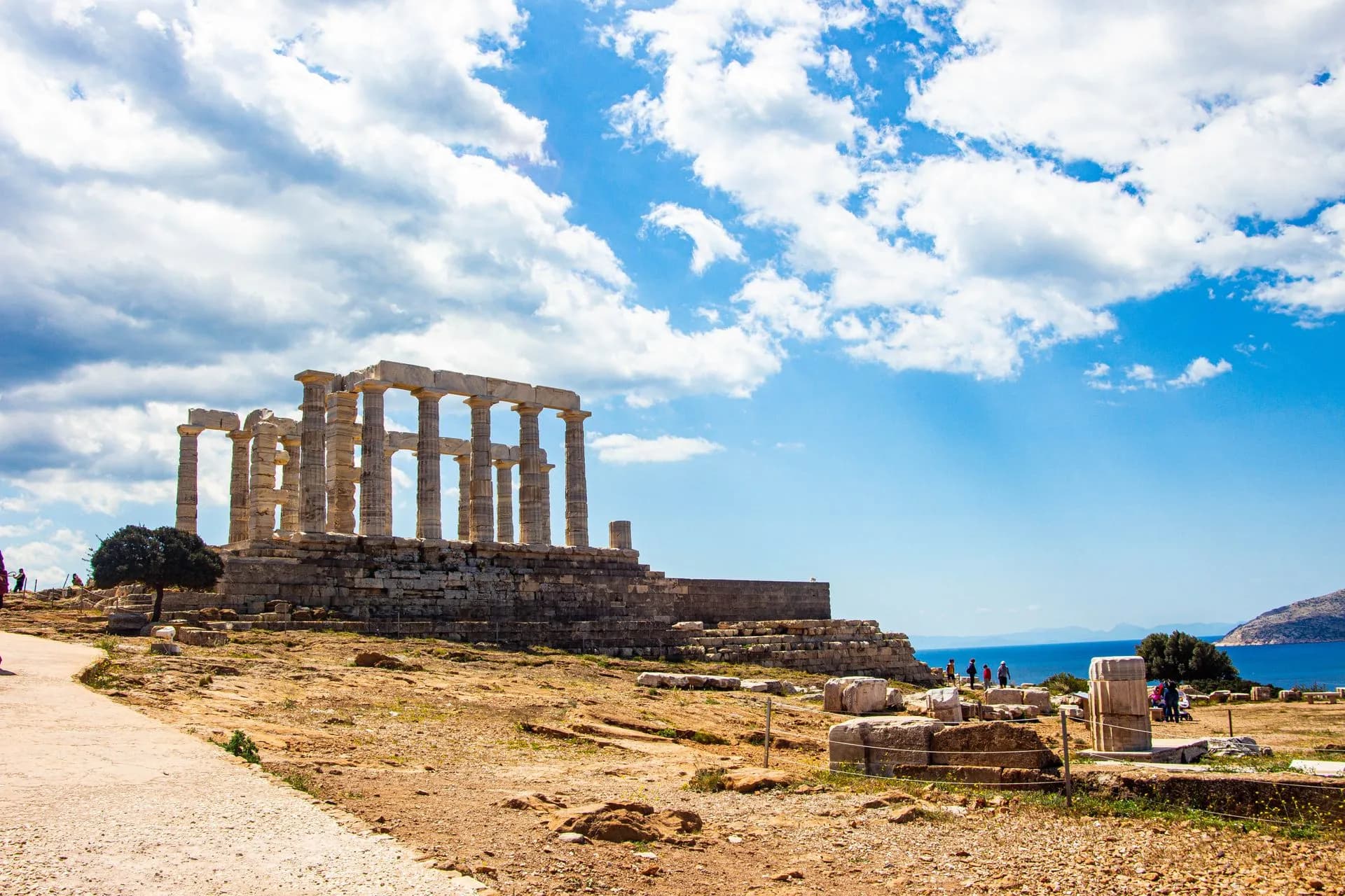 The Doric columns of the Temple of Poseidon at Cape Sounion above the Aegean at sunset