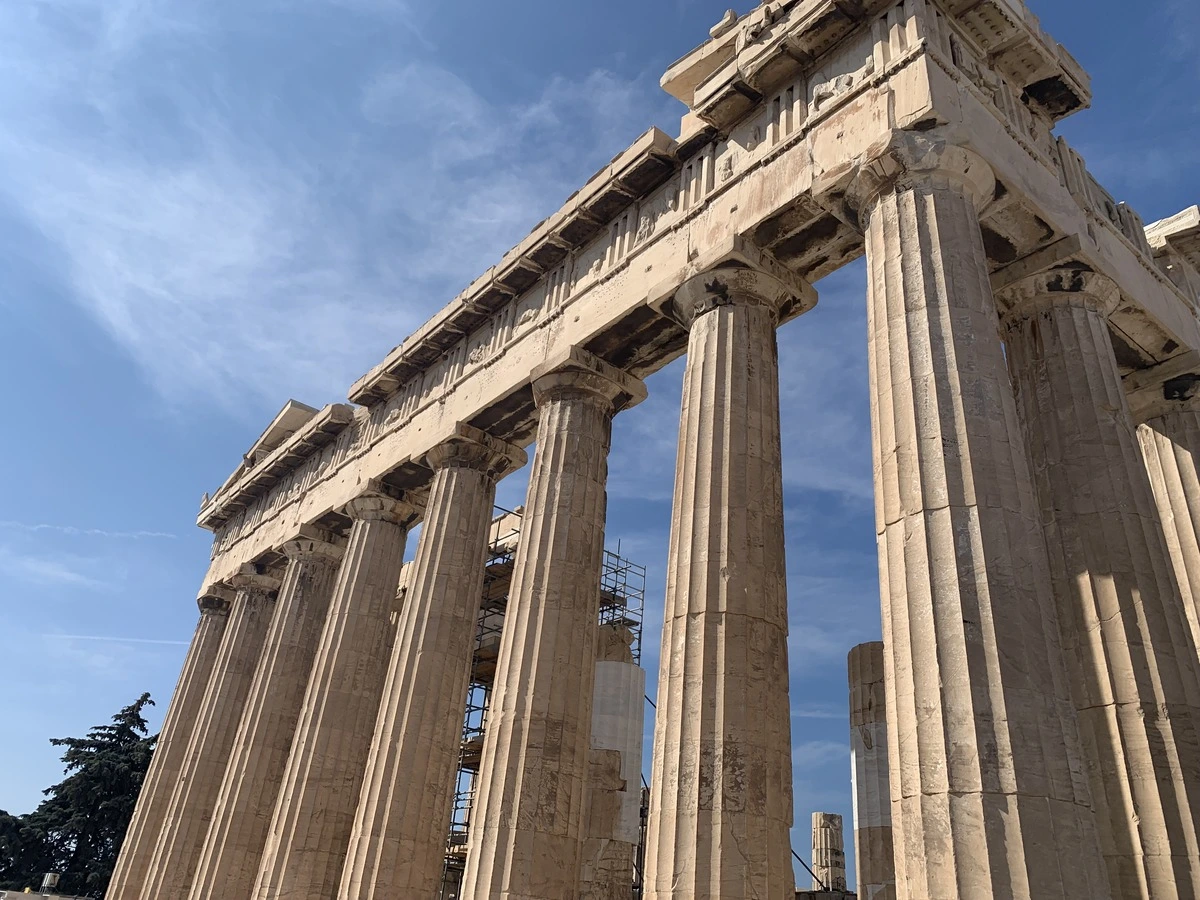 Side view of the Acropolis rock in Athens with the Parthenon above the old town